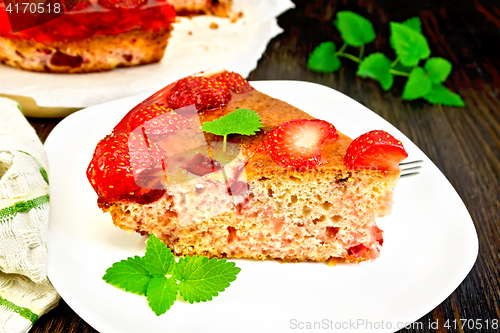 Image of Pie strawberry with jelly in plate on dark board