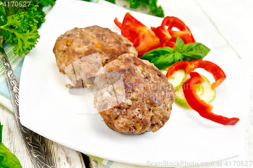 Image of Cutlets stuffed with basil in plate on light board