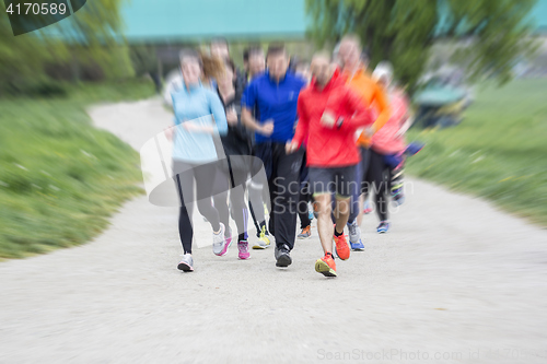 Image of Fitness sport Group of people running jogging outside on road