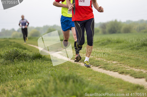 Image of Marathon running in the outside on road