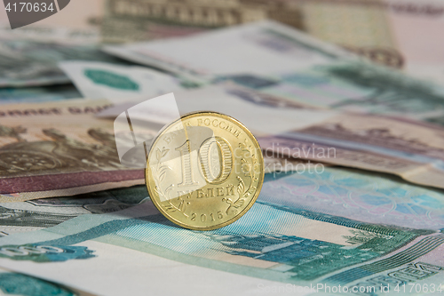 Image of On the Russian paper banknotes standing on the edge of Russian ten-coin