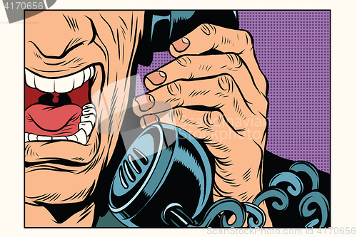 Image of Angry man talking on the phone
