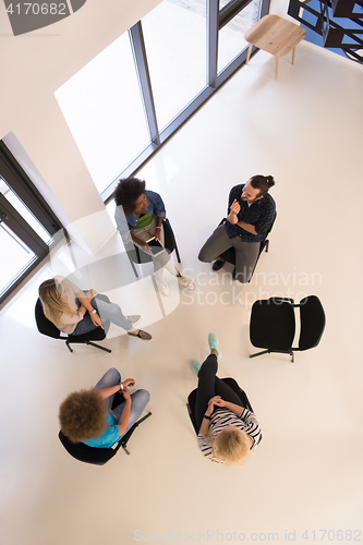 Image of Multiethnic startup business team on meeting  top view