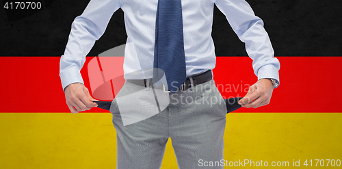 Image of close up of german businessman with empty pockets