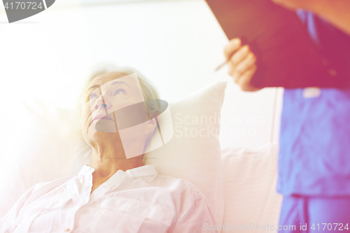 Image of nurse and senior woman patient at hospital