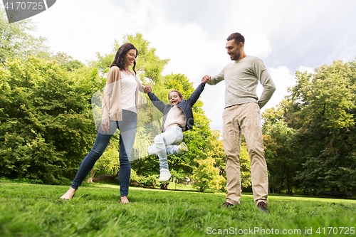 Image of happy family walking in summer park and having fun