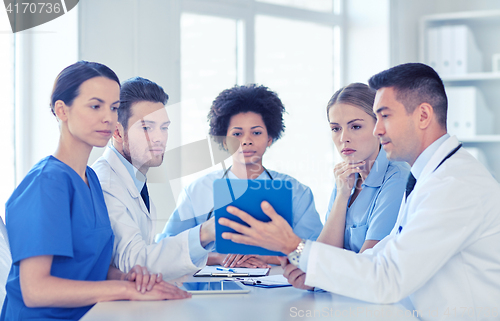 Image of group of happy doctors meeting at hospital office