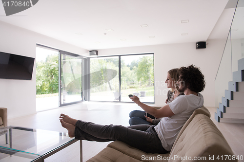 Image of young couple relaxes in the living room