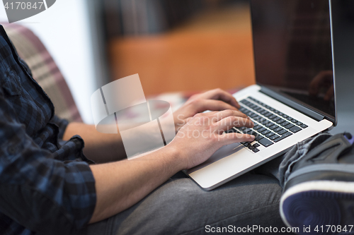 Image of man working with laptop