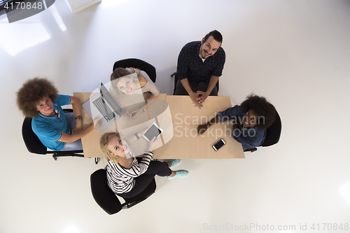 Image of Multiethnic startup business team on meeting  top view