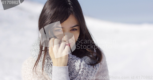 Image of Happy cute asian girl enjoying her winter time