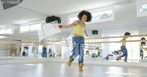 Image of Adorable african american girl dancing in studio