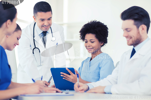 Image of group of happy doctors meeting at hospital office