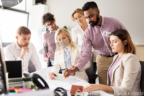 Image of business team discussing house project at office