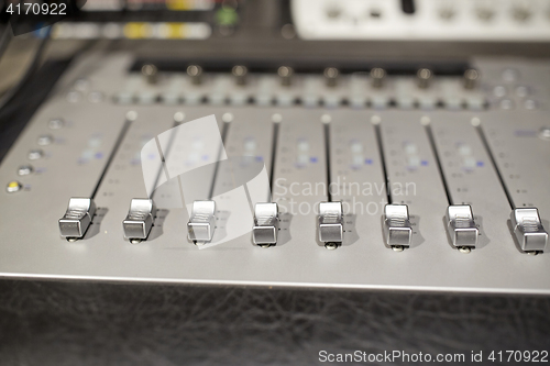 Image of music mixing console at sound recording studio