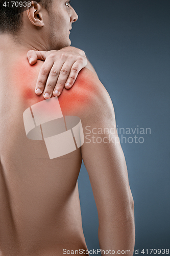 Image of Man with pain in shoulder