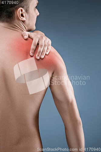 Image of Man with pain in shoulder