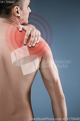 Image of Man with pain in shoulder