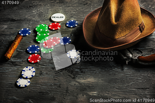 Image of Cigar, chips for gamblings, drink and playing cards