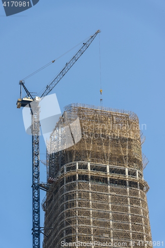 Image of Construction of skyscrapers under blue sky