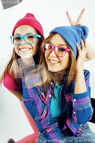 Image of lifestyle people concept: two pretty stylish modern hipster teen girl having fun together, happy smiling making selfie 