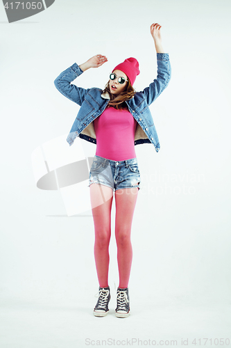 Image of young pretty teenage hipster girl posing emotional happy smiling on white background, lifestyle people concept