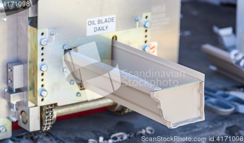 Image of Rain Gutter Feeding Through Seamless Shaping Machine