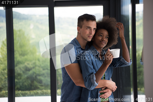 Image of romantic happy young couple relax at modern home indoors