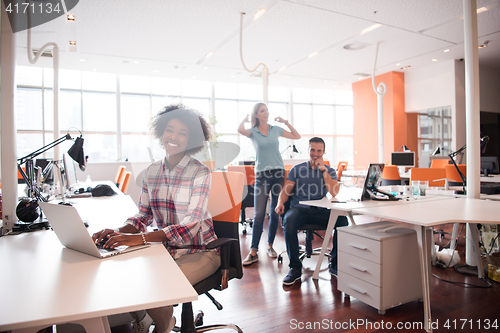 Image of African American informal business woman working in the office