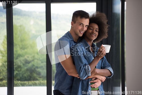 Image of romantic happy young couple relax at modern home indoors