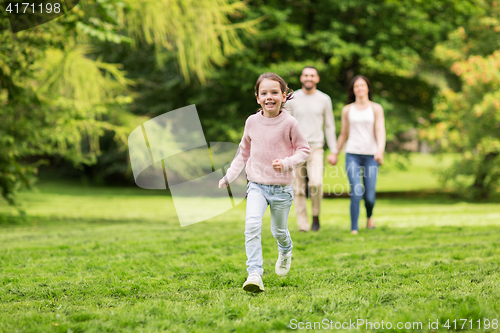 Image of happy family walking in summer park and having fun