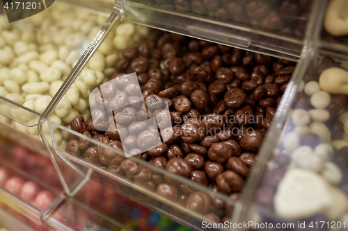 Image of close up of chocolate dragee candies in box