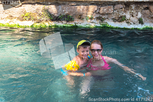 Image of woman and her son in Cleopatra pool