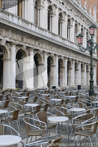 Image of Empty cafe tables and chairs in San Marco Square, Venice, Veneto