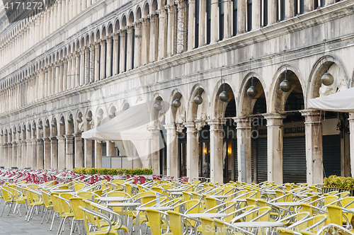 Image of Empty cafe tables and chairs in San Marco Square, Venice, Veneto