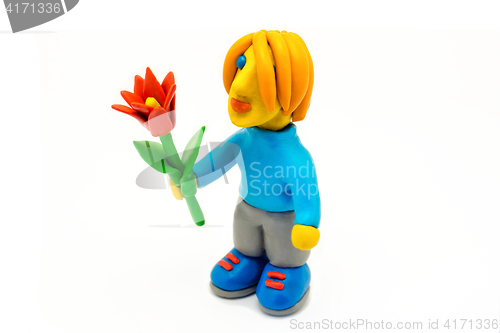 Image of Plasticine boy with red flower