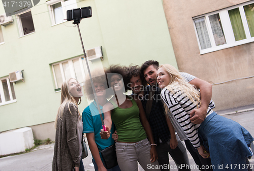 Image of Group of friends taking picture of themselves