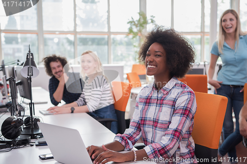 Image of African American informal business woman working in the office