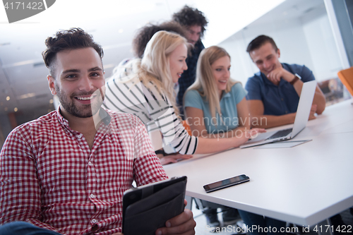 Image of Portrait of young informal businessman