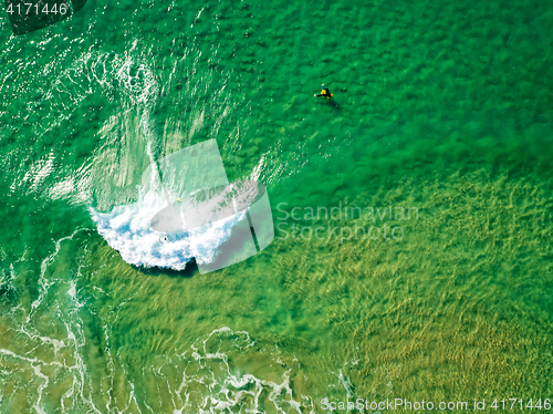 Image of Surfers Waiting Waves on the Surface of the Ocean