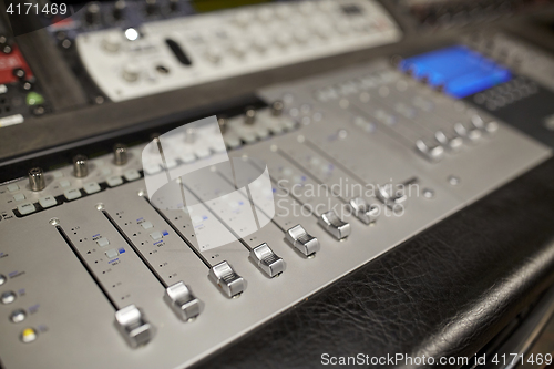 Image of music mixing console at sound recording studio