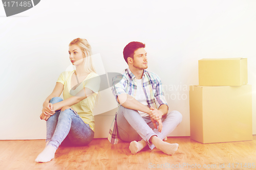 Image of unhappy couple having argument at home