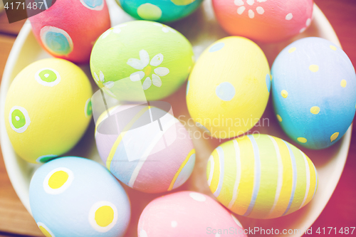 Image of close up of colored easter eggs on plate