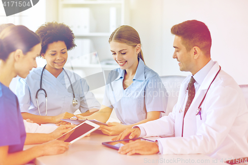 Image of group of happy doctors meeting at hospital office