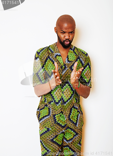 Image of portrait of young handsome african man wearing bright green nati