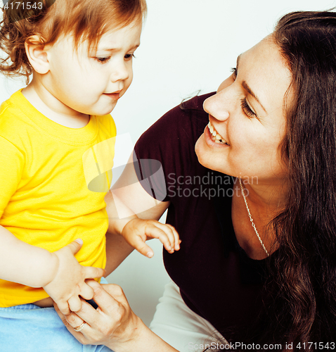 Image of pretty real normal mother with cute blond little daughter close up isolated on white background, lifestyle people concept