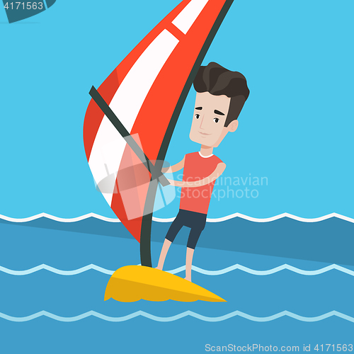 Image of Young man windsurfing in the sea.