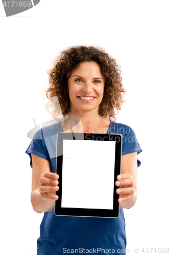 Image of Happy woman holding tablet