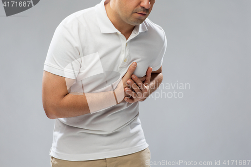 Image of close up of man suffering from heart ache