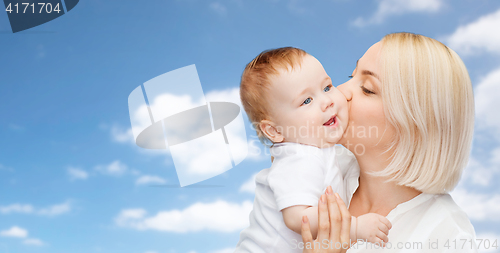 Image of happy mother kissing adorable baby